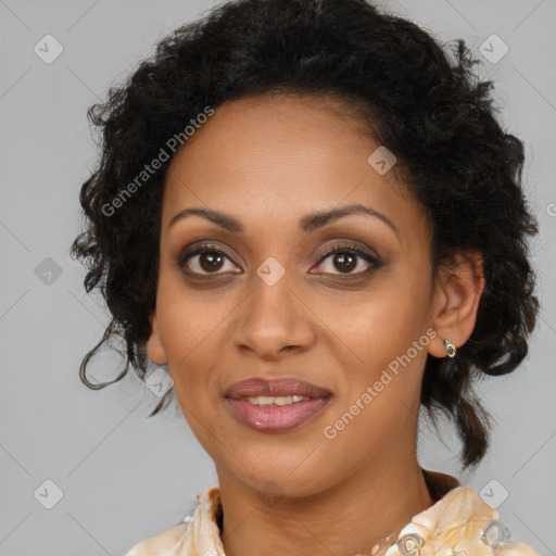 Joyful black adult female with medium  brown hair and brown eyes