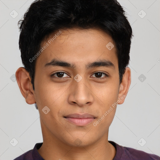 Joyful latino young-adult male with short  brown hair and brown eyes