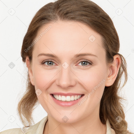 Joyful white young-adult female with medium  brown hair and blue eyes