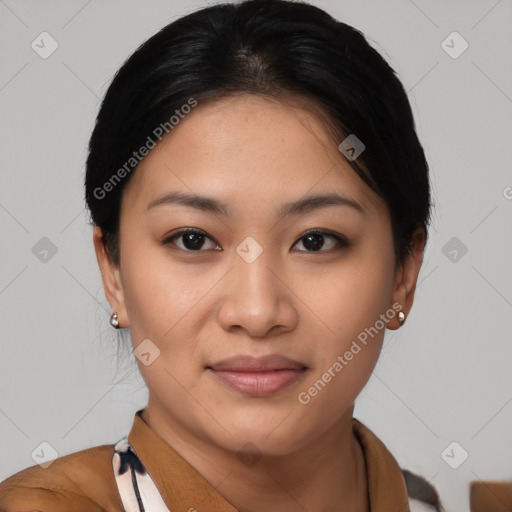 Joyful latino young-adult female with short  black hair and brown eyes