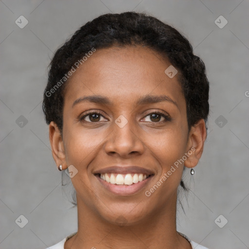 Joyful black young-adult female with short  brown hair and brown eyes