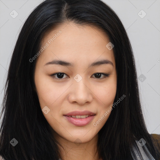 Joyful asian young-adult female with long  brown hair and brown eyes