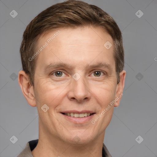 Joyful white adult male with short  brown hair and grey eyes