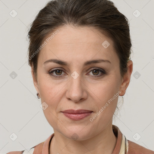 Joyful white adult female with short  brown hair and grey eyes