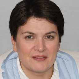 Joyful white adult female with short  brown hair and brown eyes