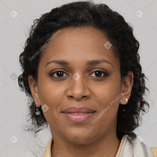 Joyful black adult female with short  brown hair and brown eyes