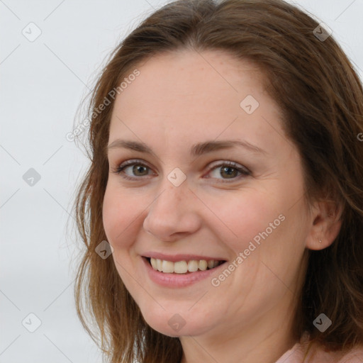 Joyful white young-adult female with long  brown hair and grey eyes