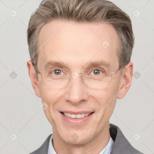 Joyful white adult male with short  brown hair and grey eyes