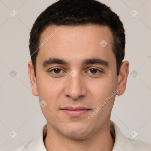 Joyful white young-adult male with short  black hair and brown eyes