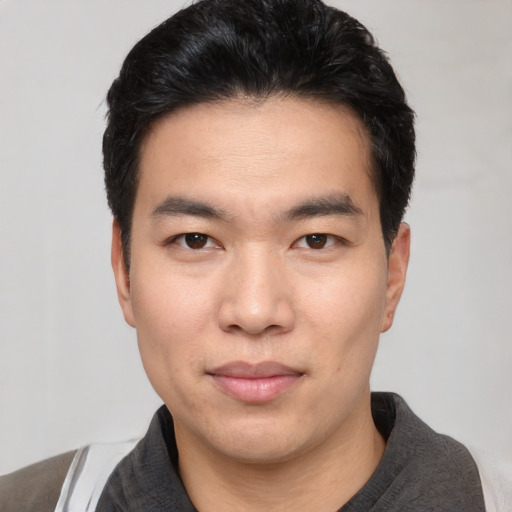Neutral asian young-adult male with short  black hair and brown eyes