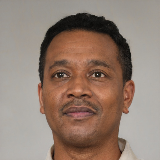 Neutral black adult male with short  black hair and brown eyes