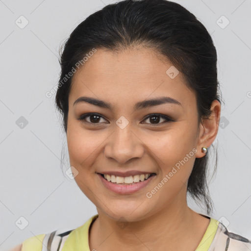 Joyful latino young-adult female with medium  brown hair and brown eyes