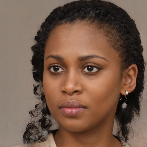 Neutral black young-adult female with long  black hair and brown eyes