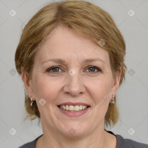 Joyful white adult female with medium  brown hair and grey eyes