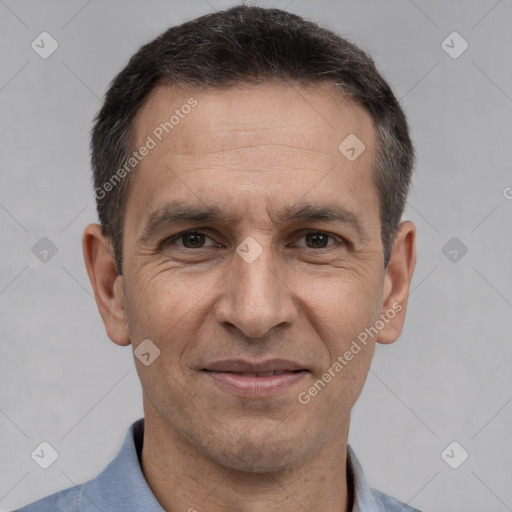 Joyful white adult male with short  black hair and brown eyes