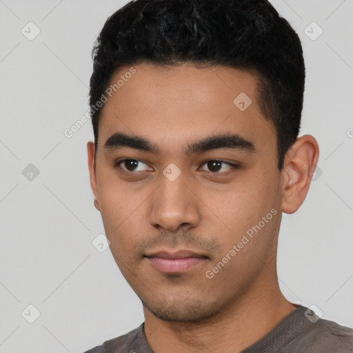 Neutral latino young-adult male with short  black hair and brown eyes