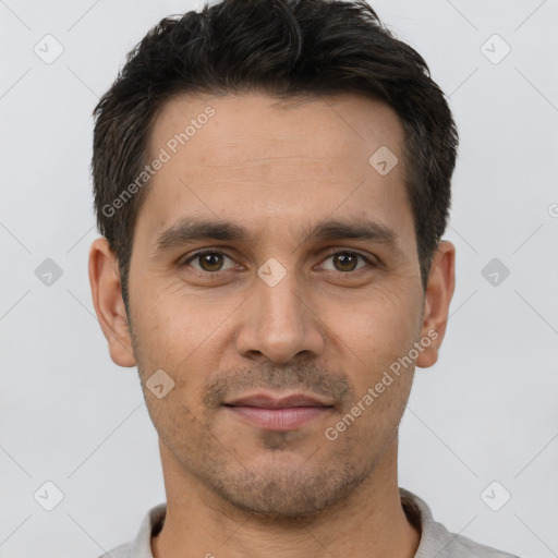 Joyful white young-adult male with short  brown hair and brown eyes