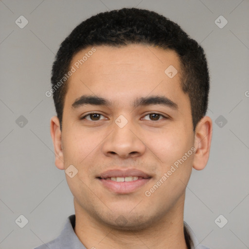 Joyful latino young-adult male with short  black hair and brown eyes