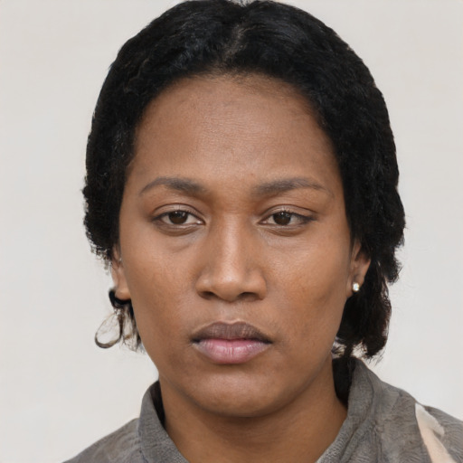 Neutral black young-adult female with short  black hair and brown eyes