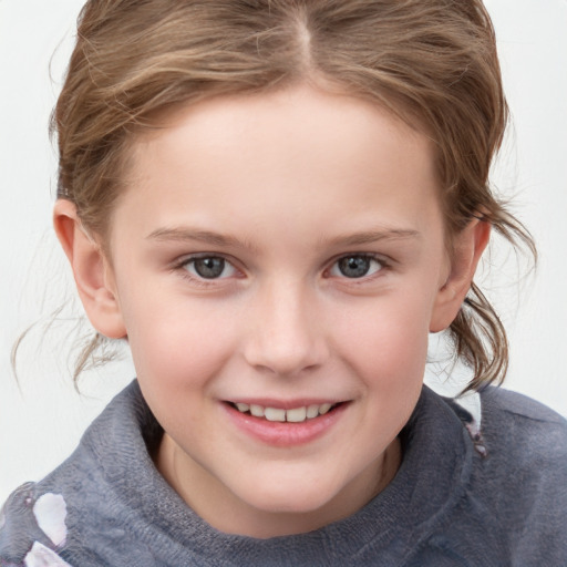 Joyful white child female with medium  brown hair and grey eyes