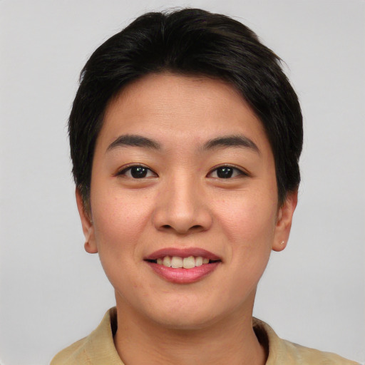 Joyful asian young-adult female with short  black hair and brown eyes
