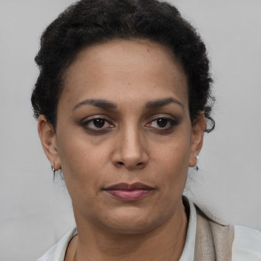 Neutral black young-adult female with short  brown hair and brown eyes