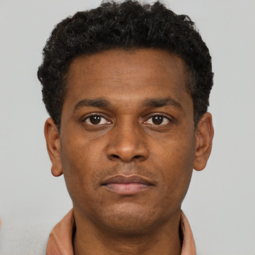 Neutral black young-adult male with short  brown hair and brown eyes
