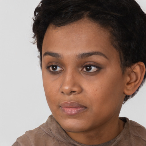 Neutral black young-adult female with short  brown hair and brown eyes