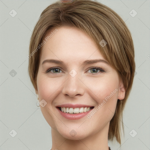 Joyful white young-adult female with medium  brown hair and green eyes