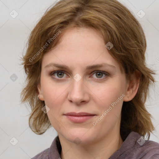 Joyful white young-adult female with medium  brown hair and green eyes