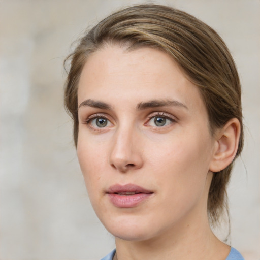 Neutral white young-adult female with medium  brown hair and green eyes