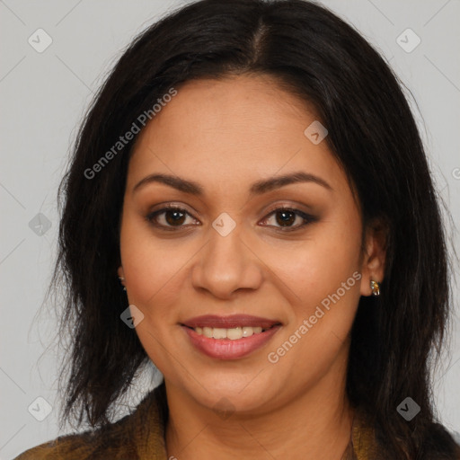 Joyful latino young-adult female with long  brown hair and brown eyes