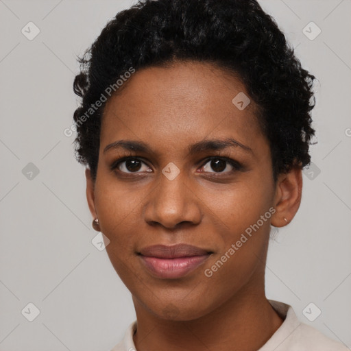 Joyful black young-adult female with short  black hair and brown eyes