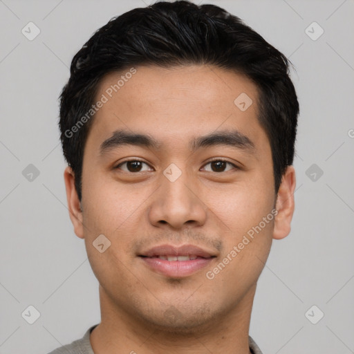 Joyful asian young-adult male with short  black hair and brown eyes