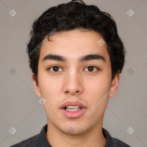 Neutral white young-adult male with short  black hair and brown eyes