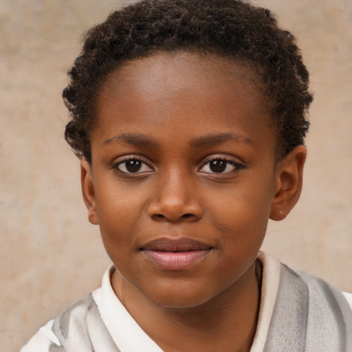 Joyful black child female with short  brown hair and brown eyes