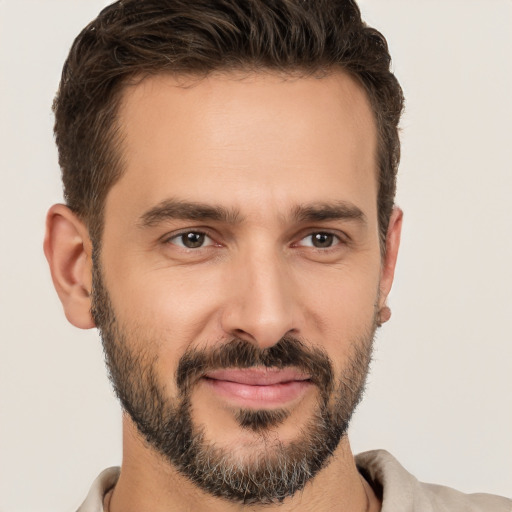 Joyful white young-adult male with short  brown hair and brown eyes