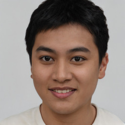 Joyful asian young-adult male with short  black hair and brown eyes