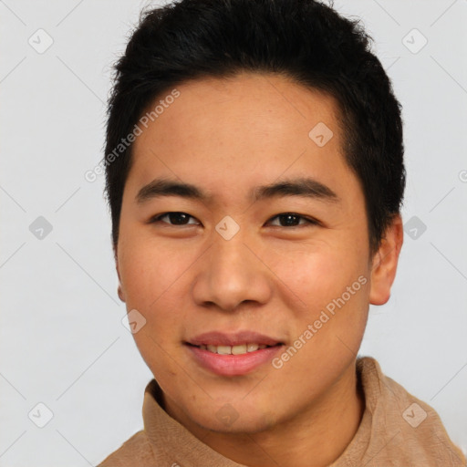 Joyful asian young-adult male with short  brown hair and brown eyes