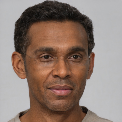 Neutral black adult male with short  black hair and brown eyes