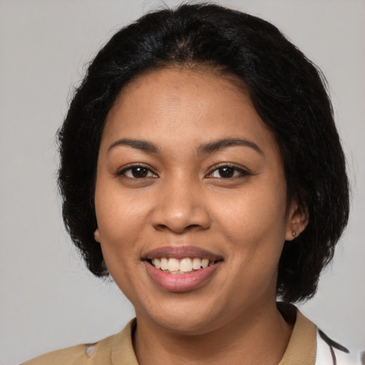 Joyful latino young-adult female with medium  black hair and brown eyes