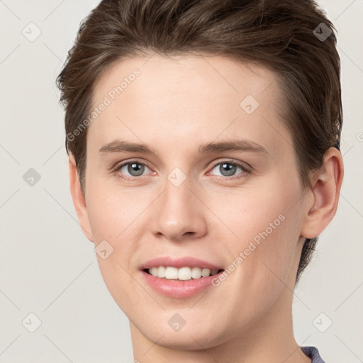 Joyful white young-adult female with short  brown hair and grey eyes