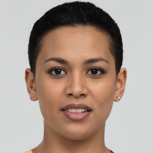 Joyful latino young-adult female with short  brown hair and brown eyes