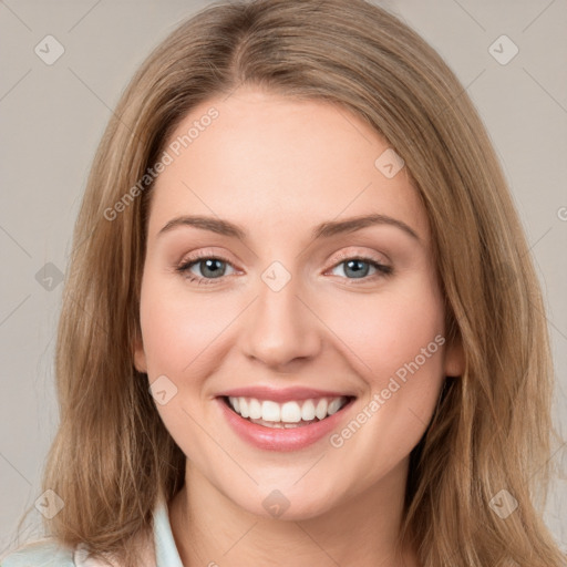 Joyful white young-adult female with long  brown hair and green eyes