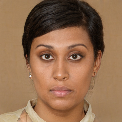 Neutral latino young-adult female with medium  brown hair and brown eyes