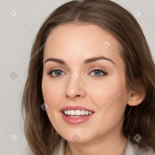 Joyful white young-adult female with long  brown hair and grey eyes