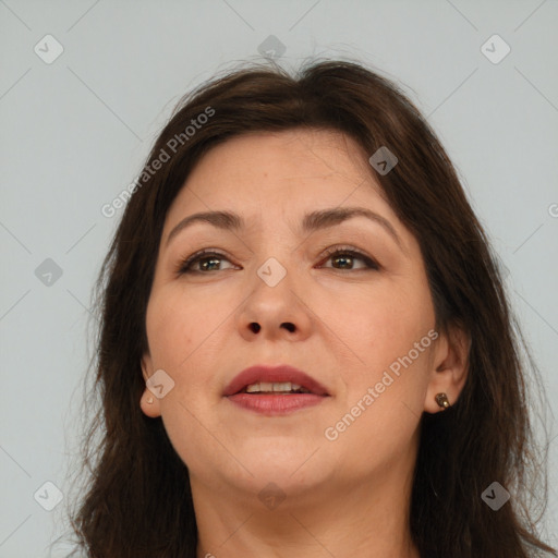 Joyful white adult female with long  brown hair and brown eyes