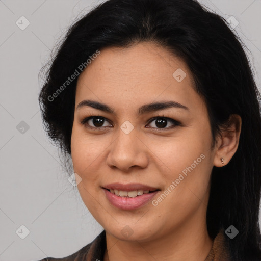 Joyful latino young-adult female with long  brown hair and brown eyes