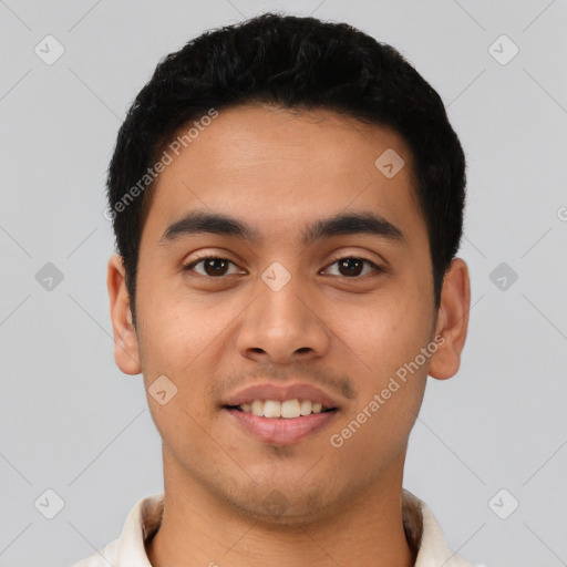 Joyful latino young-adult male with short  black hair and brown eyes