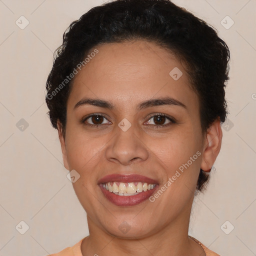 Joyful latino young-adult female with short  brown hair and brown eyes